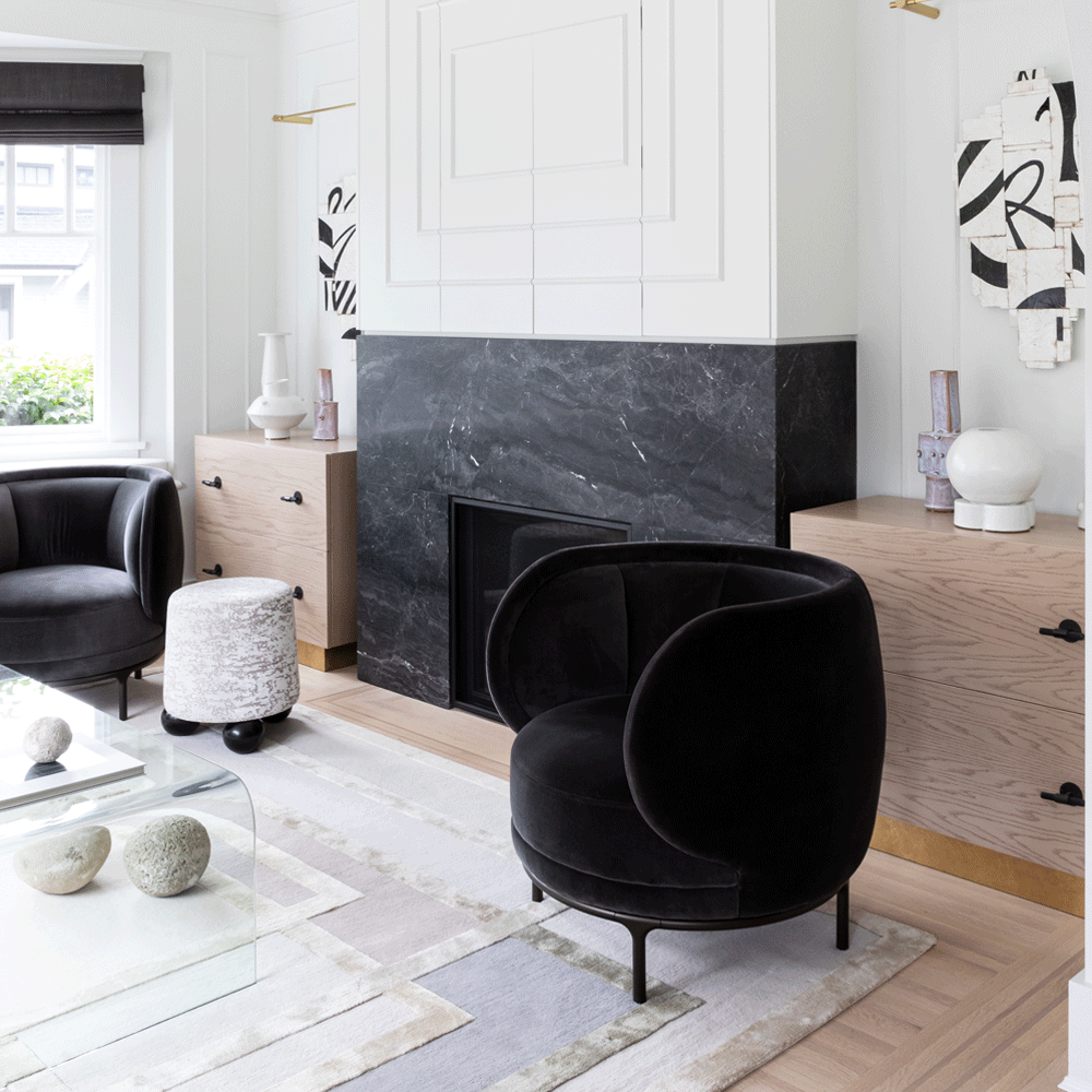 living room with black sofa chair and white flooring