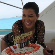 Kourtney Kardashian. with birthday cake