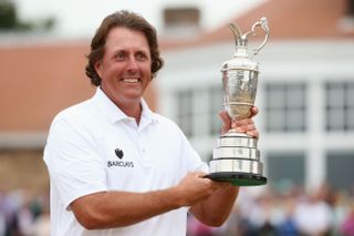 Phil Mickelson holds the Claret Jug after winning the 2013 Open
