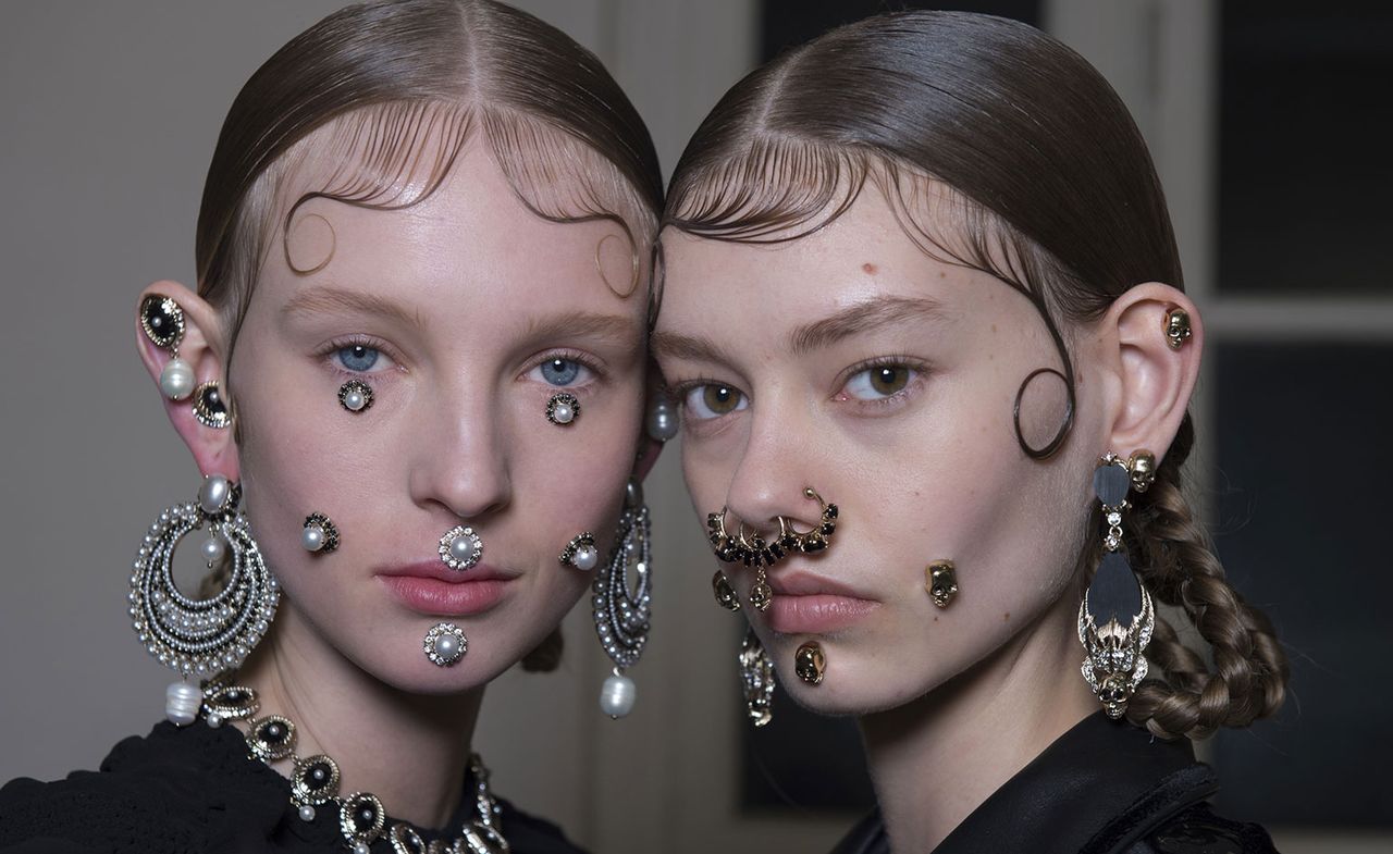 Crystal and enamel hoops and nose rings, which spiced up his more buttoned-up, Victorian-esque wears