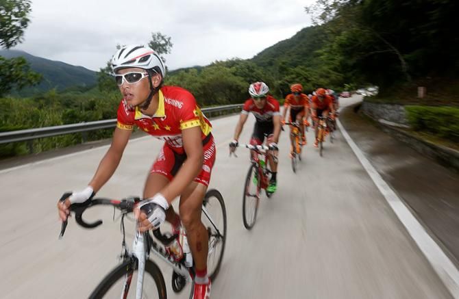 Riders race toward the finish line in Wuzhishan