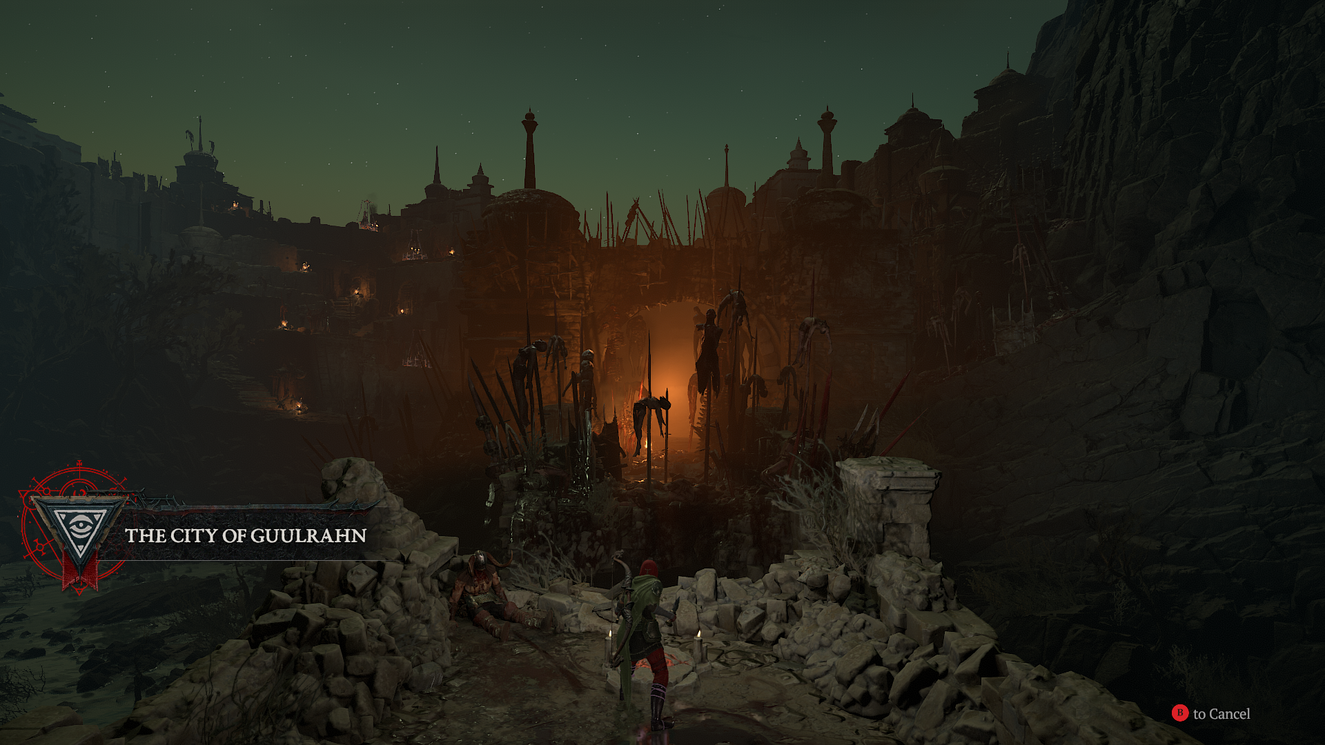 The player character looking out at a cursed and conquered city in Diablo 4.