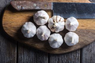 garlic on wooden chopping board