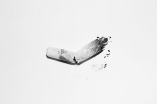 Black and white image of broken cigarette