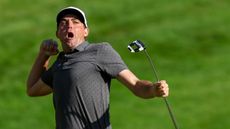 Keegan Bradley of the United States celebrates winning on the 18th green during the final round of the Travelers Championship at TPC River Highlands