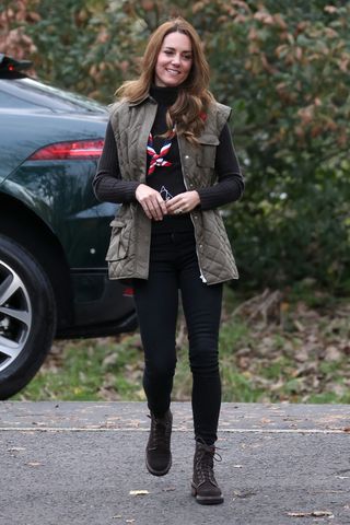 Kate Middleton wears brown walking boots during a visit to Alexandra Park Sports Hub in Glasgow, Scotland. 2021