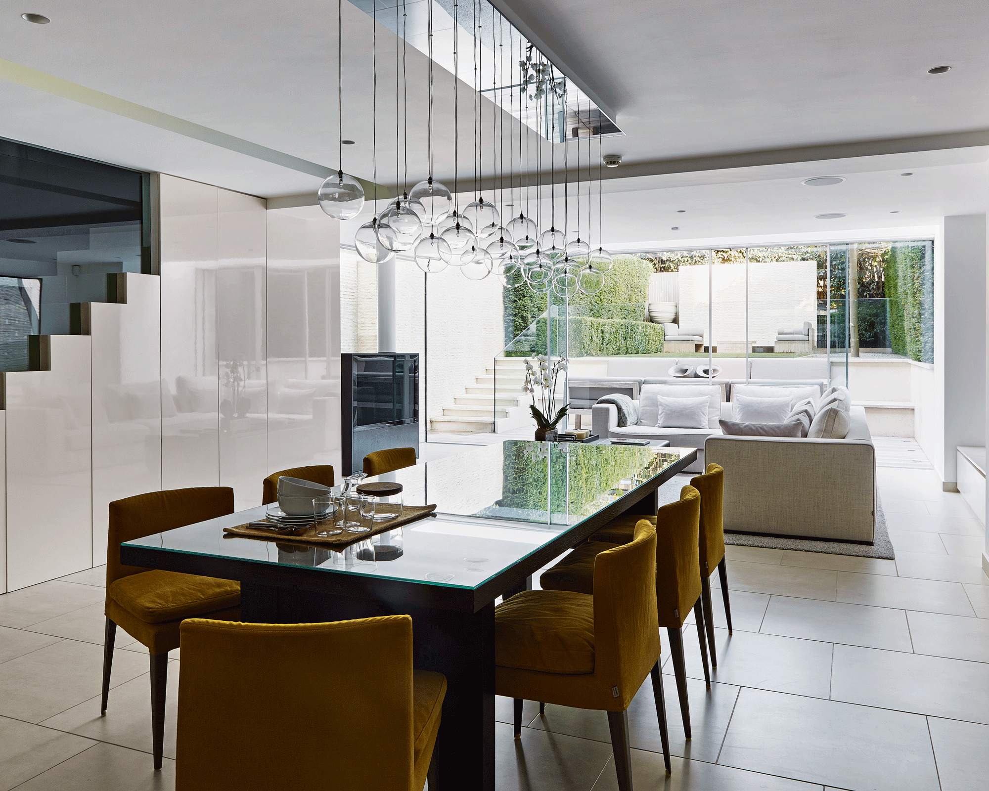 Basement extension with dining table looking out to the garden