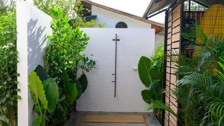 how to install an outdoor shower with plants
