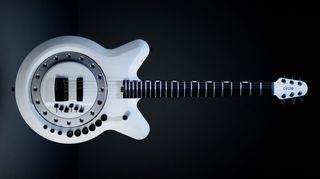 A photo showing Circle Instruments' Circle guitar against a black background