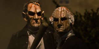 People wearing Lincoln and Washington masks in The Purge Election Year.