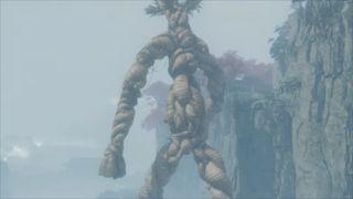 Rope Man in Sekiro viewed from behind, showing him approaching the Fountainhead Palace atop massive cliffs.
