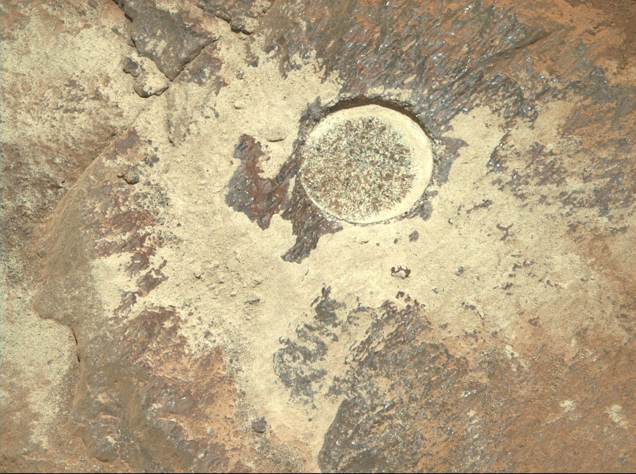These close-up photos show the drill marks mark on a layered Mars rock under study by NASA's Perseverance rover for possible sample collection in November 2021.