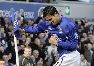 Tim Cahill celebrates after scoring for Everton against Aston Villa in 2006 by boxing the corner flag.