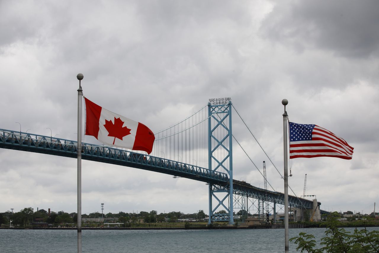 canadian and american flags at the U.S.-Canada border