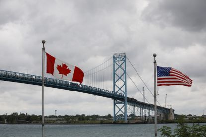 canadian and american flags at the U.S.-Canada border
