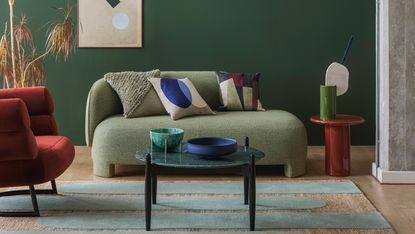 Green living room with grey sofa