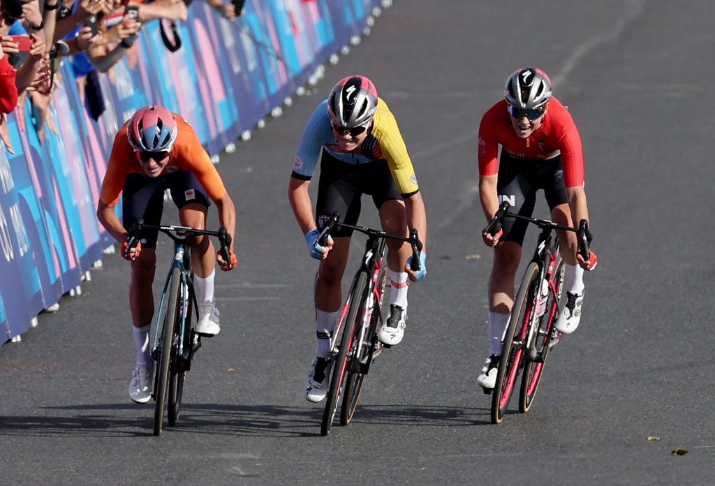 PARIS FRANCE AUGUST 04 EDITORS NOTE Alternate crop LR Marianne Vos of Team Netherlands Lotte Kopecky of Team Belgium and Blanka Vas of Team Hungary sprint at finish line to win the Silver and Bronze medal during the Womens Road Race on day nine of the Olympic Games Paris 2024 at Trocadero on August 04 2024 in Paris France Photo by Tim de WaeleGetty Images