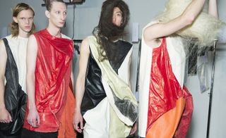 Four male models in a line wearing Rick Owen's collection