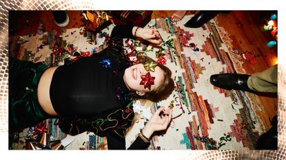 Ethical gifts: A woman lying on the floor surrounded in wrapping paper