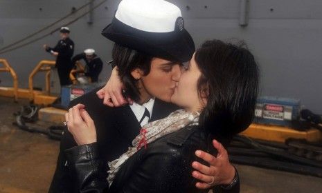 Petty Officer 2nd Class Marissa Gaeta, 23, and Petty Officer 3rd Class Citlalic Snell, 22, shared a first kiss Wednesday after Gaeta returned from 80 days at sea.