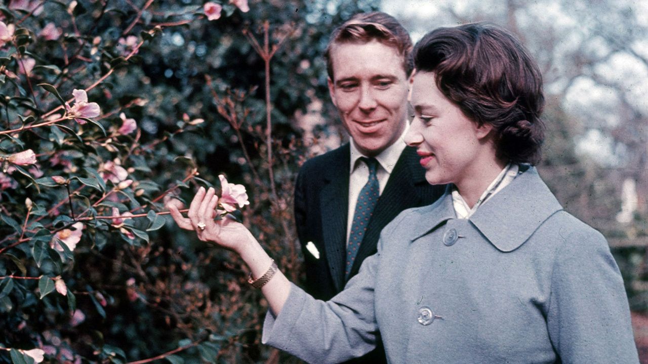 Princess Margaret and Lord Snowdon walk in Windsor Great Park on the day they announced their engagement, 27 February 1960