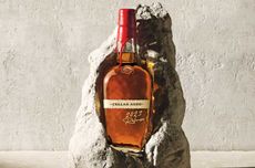 A bottle of Maker&rsquo;s Mark Cellar Aged set in a piece of limestone