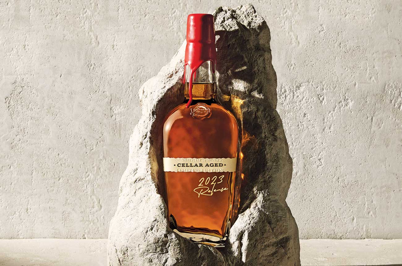 A bottle of Maker&rsquo;s Mark Cellar Aged set in a piece of limestone