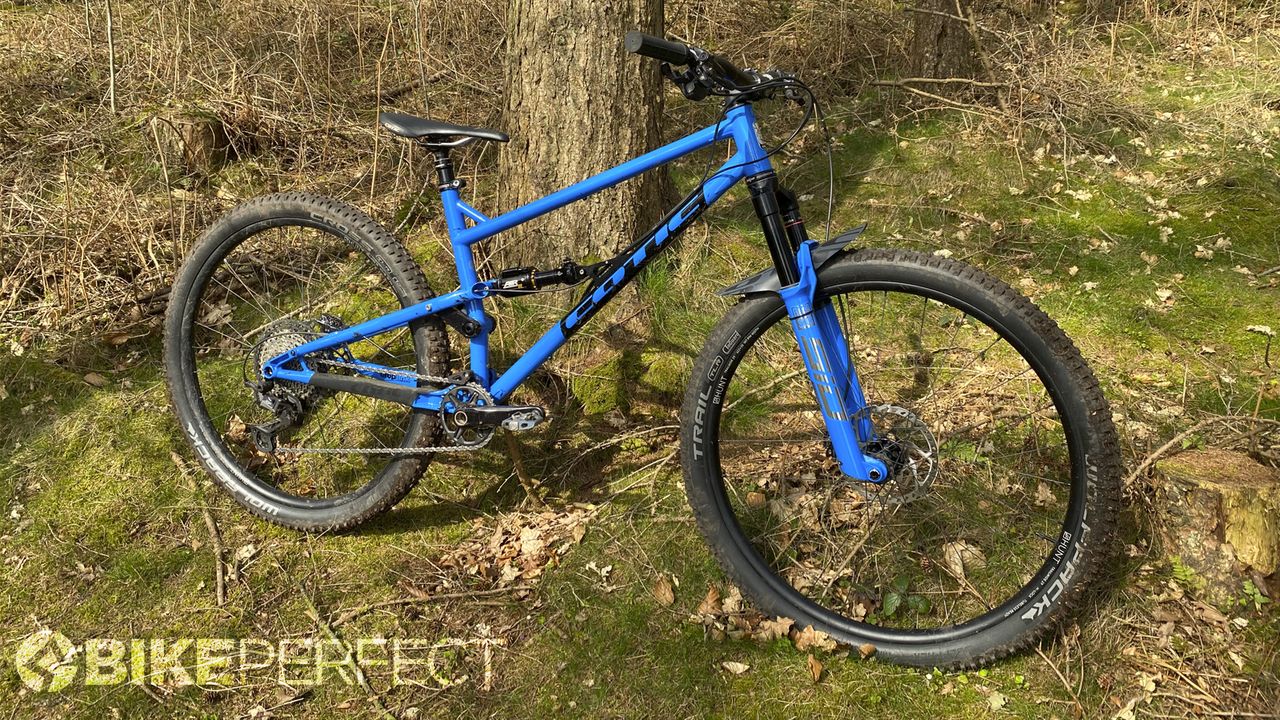 Cotic FlareMAX Gen 4 standing proud against a tree-lined backdrop