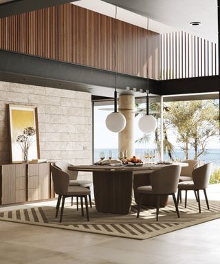 modern double height dining room with picture window and stone flooring