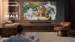 A man viewing the Samsung R95H in a living room.