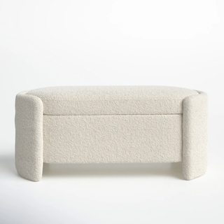 Boucle storage ottoman recommended for handbags.