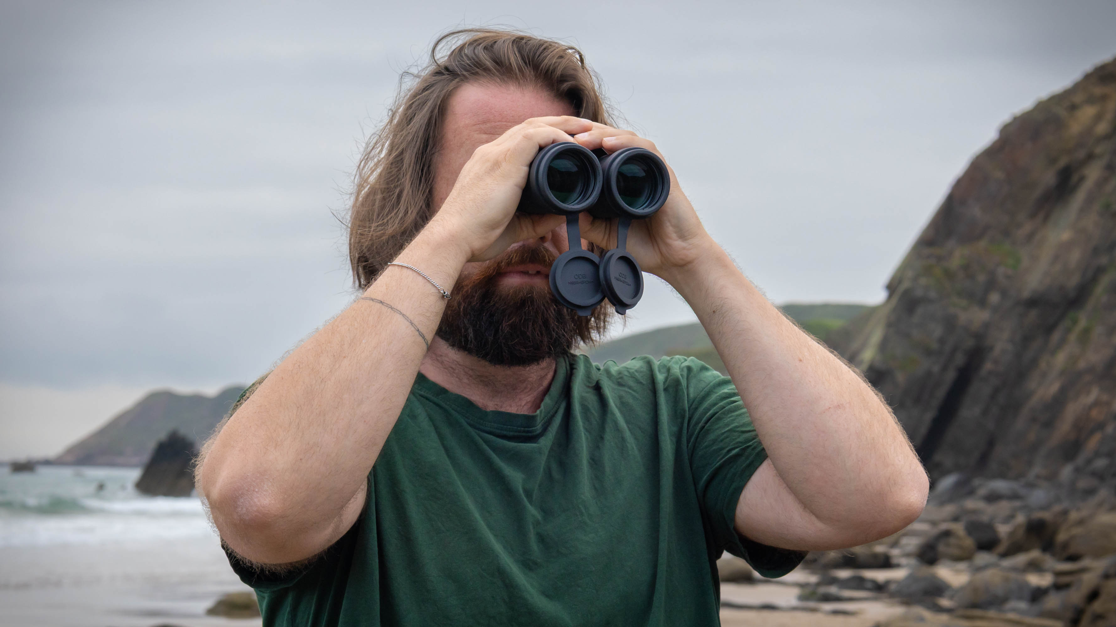 A male using the Nikon Monarch M7 8x42 binoculars.