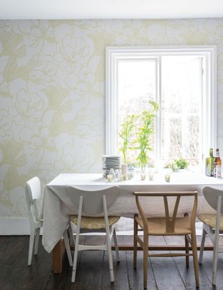 Yellow and white dining room with pale yellow Farrow & Ball wallpaper