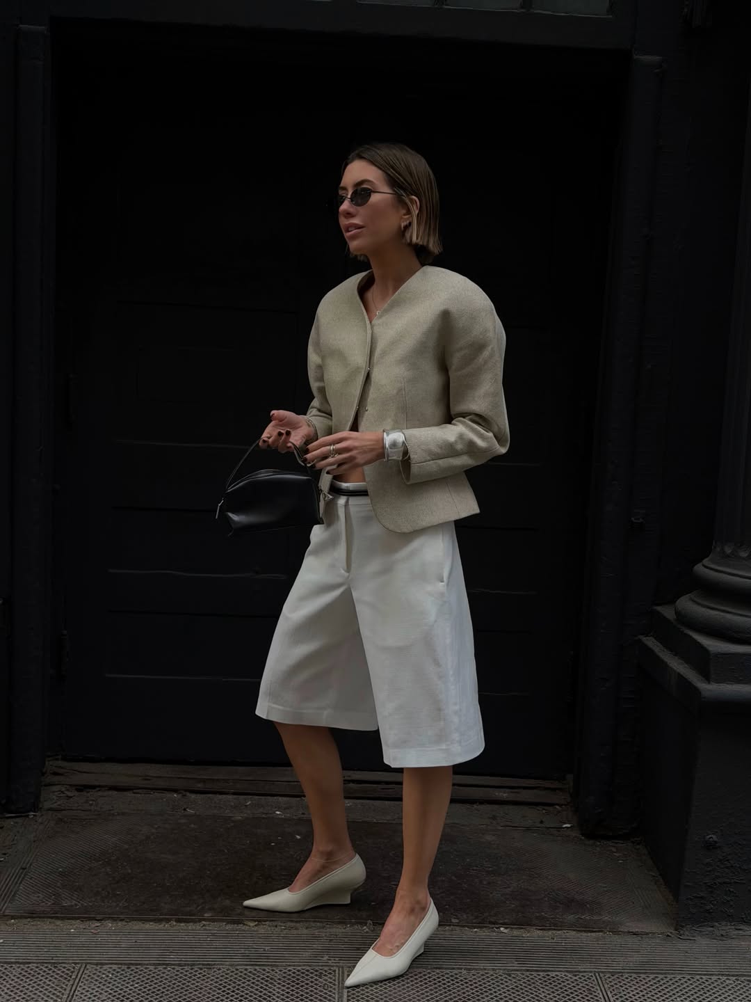 Hannah in linen blazer and Bermuda shorts