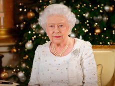 Queen Elizabeth II poses at a desk in the 1844 Room at Buckingham Palace, London, on December 13, 2017 after recording her Christmas Day broadcast to the Commonwealth