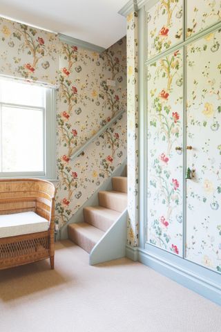 country hallway with wallpaper covering cupboards and walls