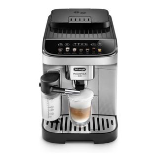 A silver and black De'Longhi Magnifica Evo with LatteCrema System coffee machine with a coffee cup