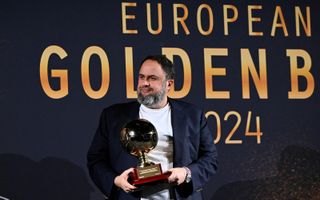 Evangelos Marinakis holds an award at the 2024 Golden Boy Awards