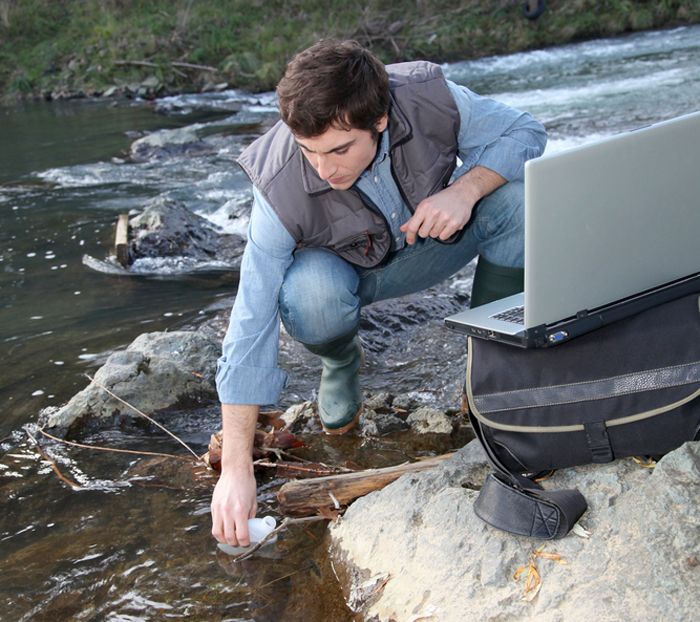 Environmental engineer checks water quality