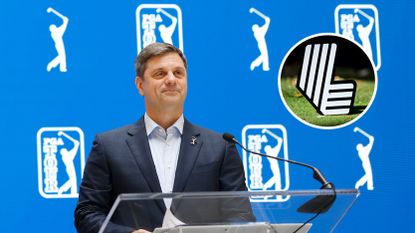 Brian Rolapp stands at a podium smiling during his pre-Players Championship press conference with a LIV Golf Logo inset in the top-right corner