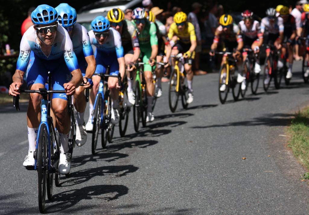 Team BikeexchangeJayco team riders lead the pack during the 13th stage of the 109th edition of the Tour de France cycling race 1926 km between Le Bourg dOisans in the French Alps and SaintEtienne in central France on July 15 2022 Photo by Thomas SAMSON AFP Photo by THOMAS SAMSONAFP via Getty Images