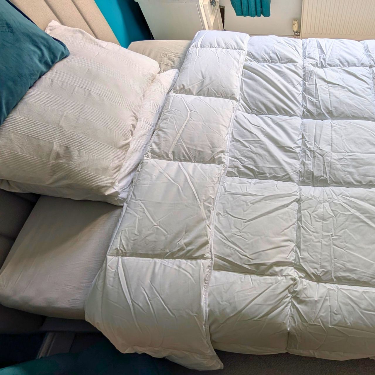 The Fine Bedding Company Smartdown Cotton Duvet pictured on the tester's bed