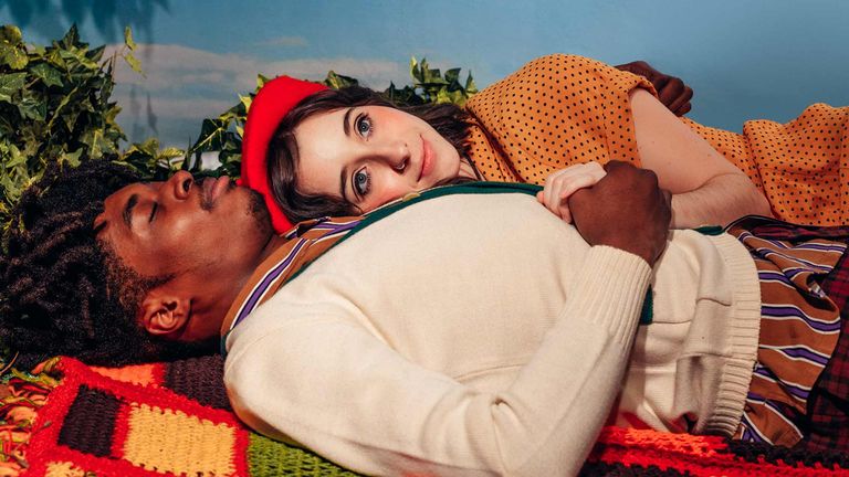 Young Couple Laying on Blanket Outside