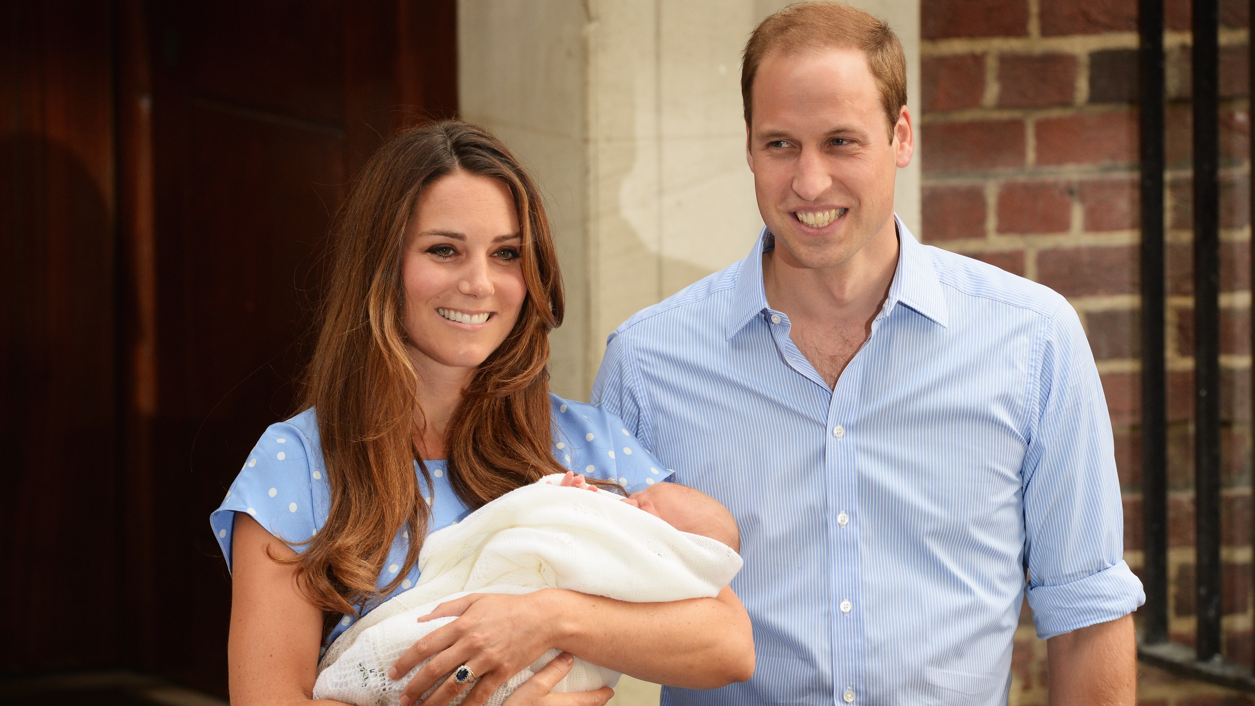 Prince William and Catherine, Princess of Wales hold their newborn son outside St Mary's Hospital on July 23, 2013