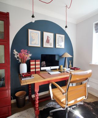 blue arch pattern painted on wall in home office
