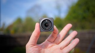 DJI Action 2 camera held in a hand