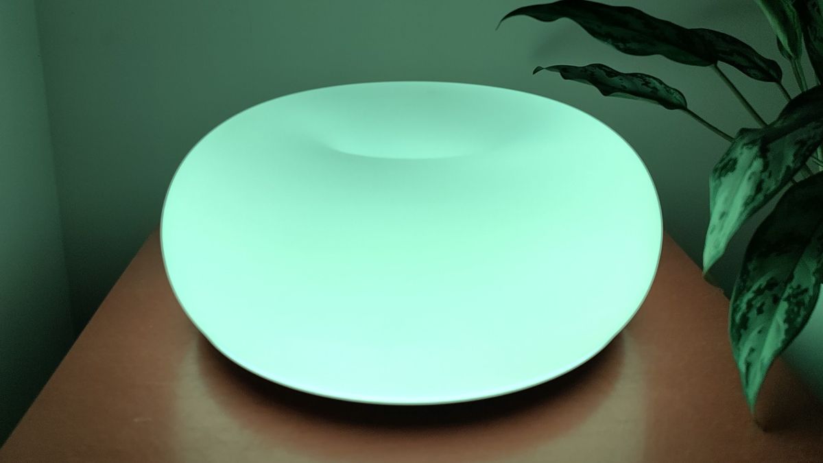 IKEA Varmblixt lamp illuminated green, on table