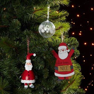 christmas tree with hanging santa clause