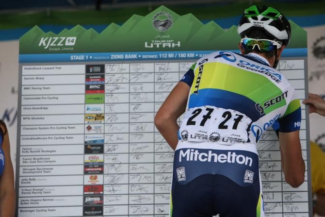 Damien Howson (Orica GreenEdge) adds his name to the big sign on board.
