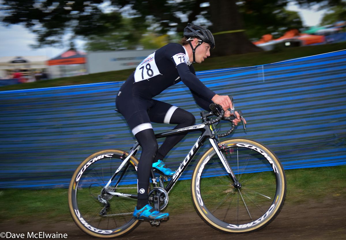 Cameron Dodge riding past the Factory Expo with less than two laps to go